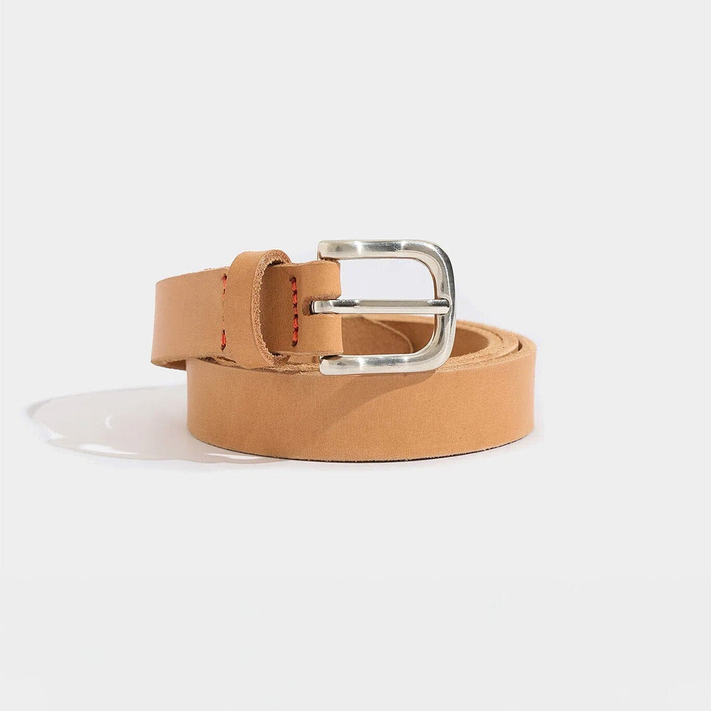 
                  
                    Tan leather belt with a silver buckle on a white background
                  
                