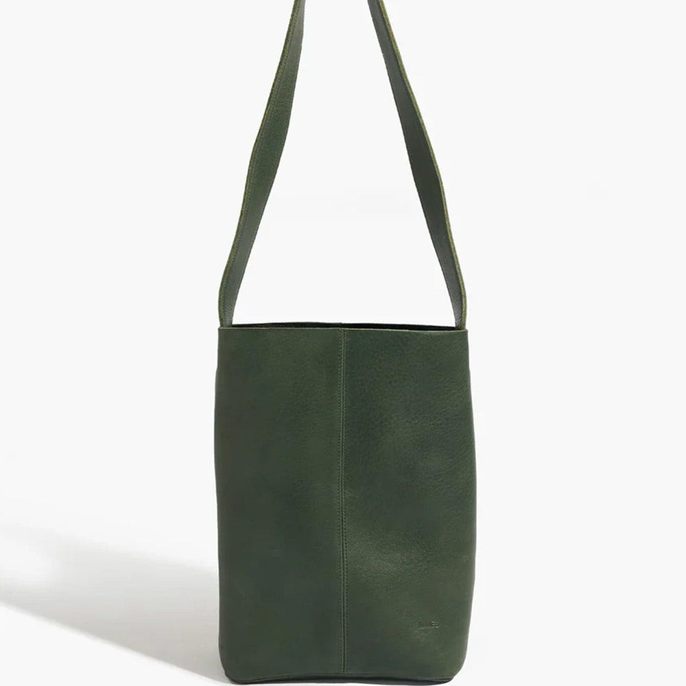 Green leather shoulder bag on a white background
