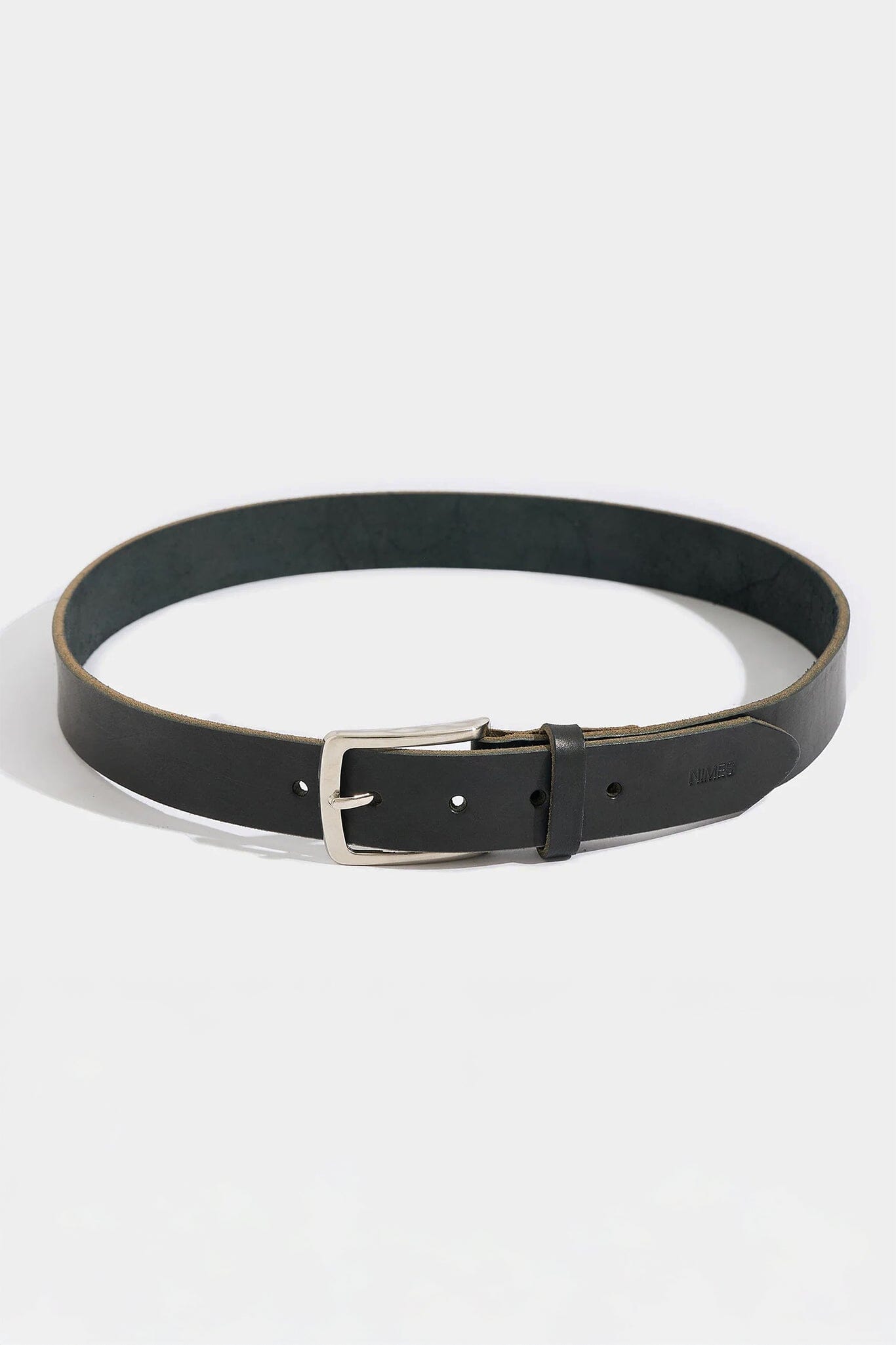 Black leather belt with a silver buckle on a white background