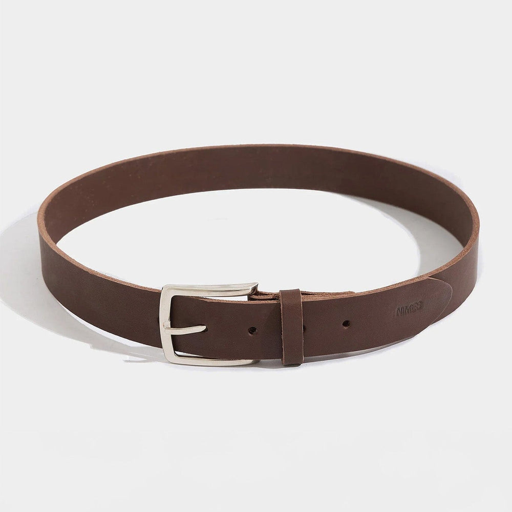 Brown leather belt with silver buckle on a white background
