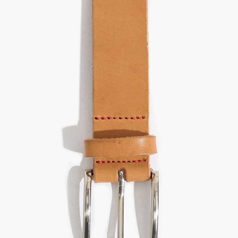 Tan leather belt with a silver buckle on a white background