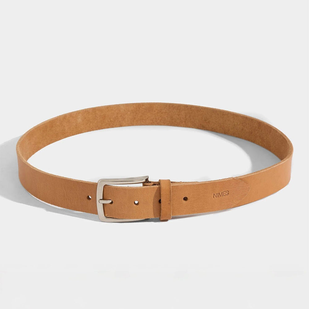 Tan belt with a silver buckle on a white background