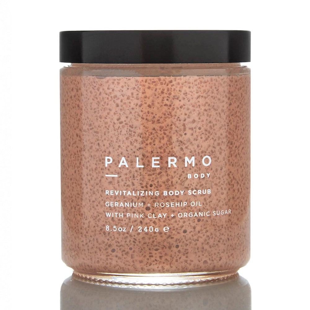 A clear jar containing a pinkish body scrub with exfoliants, labeled 'PALERMO BODY' on the front.
