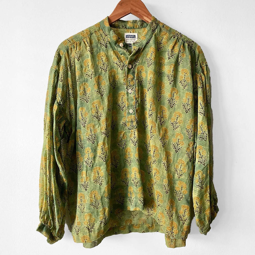 Cotton long sleeve peasant blouse featuring a spring green forest flowers print. Designed by Uqnatu, available to purchase at M.Patmos in Brooklyn, New York.