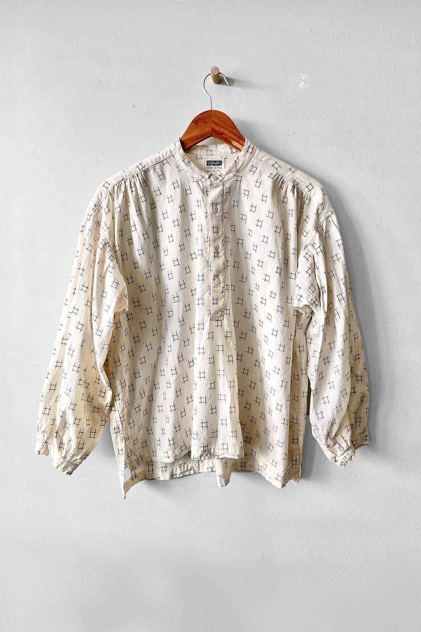 Cotton long sleeve button up blouse featuring a blue Ikat pattern. Designed by Uqnatu, available to purchase at M.Patmos in Brooklyn, New York.