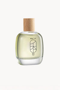Glass perfume bottle with wooden cap on a white background