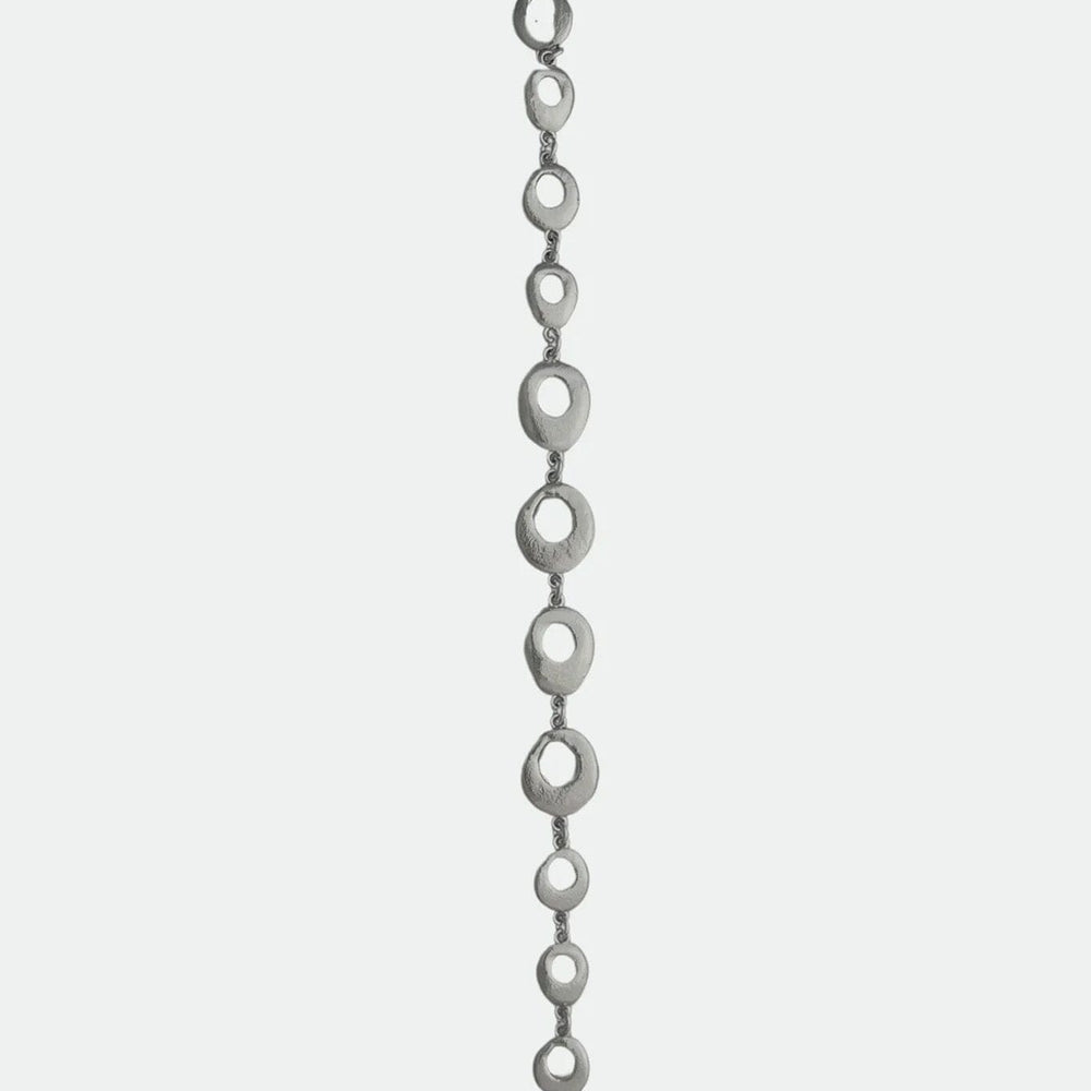
                  
                    Silver oval chain with a hook clasp on a white background
                  
                