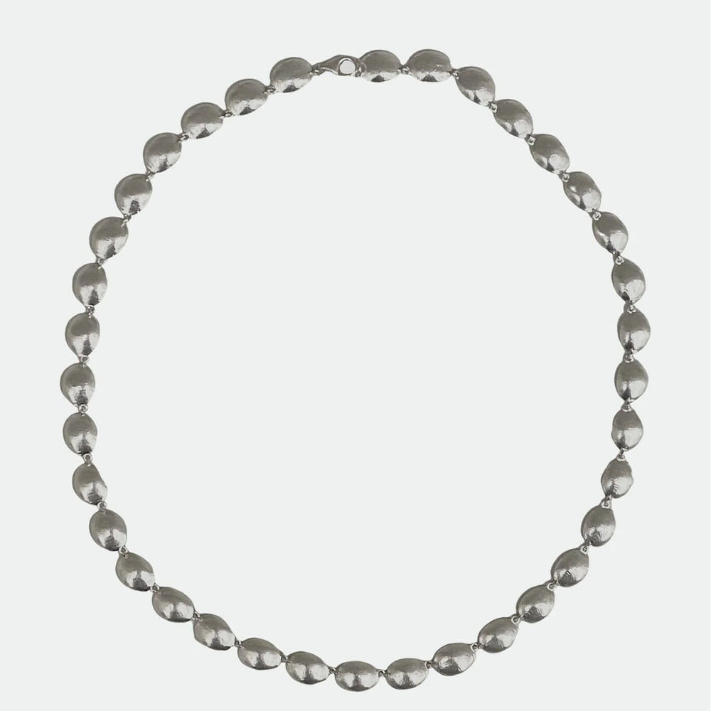 Silver beaded necklace on a white background