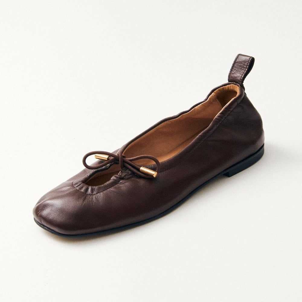 
                  
                    Side view of brown square toe flat shoes
                  
                