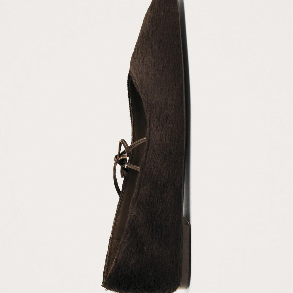 
                  
                    Side vivew of dark brown calf hair square toe women's flats
                  
                