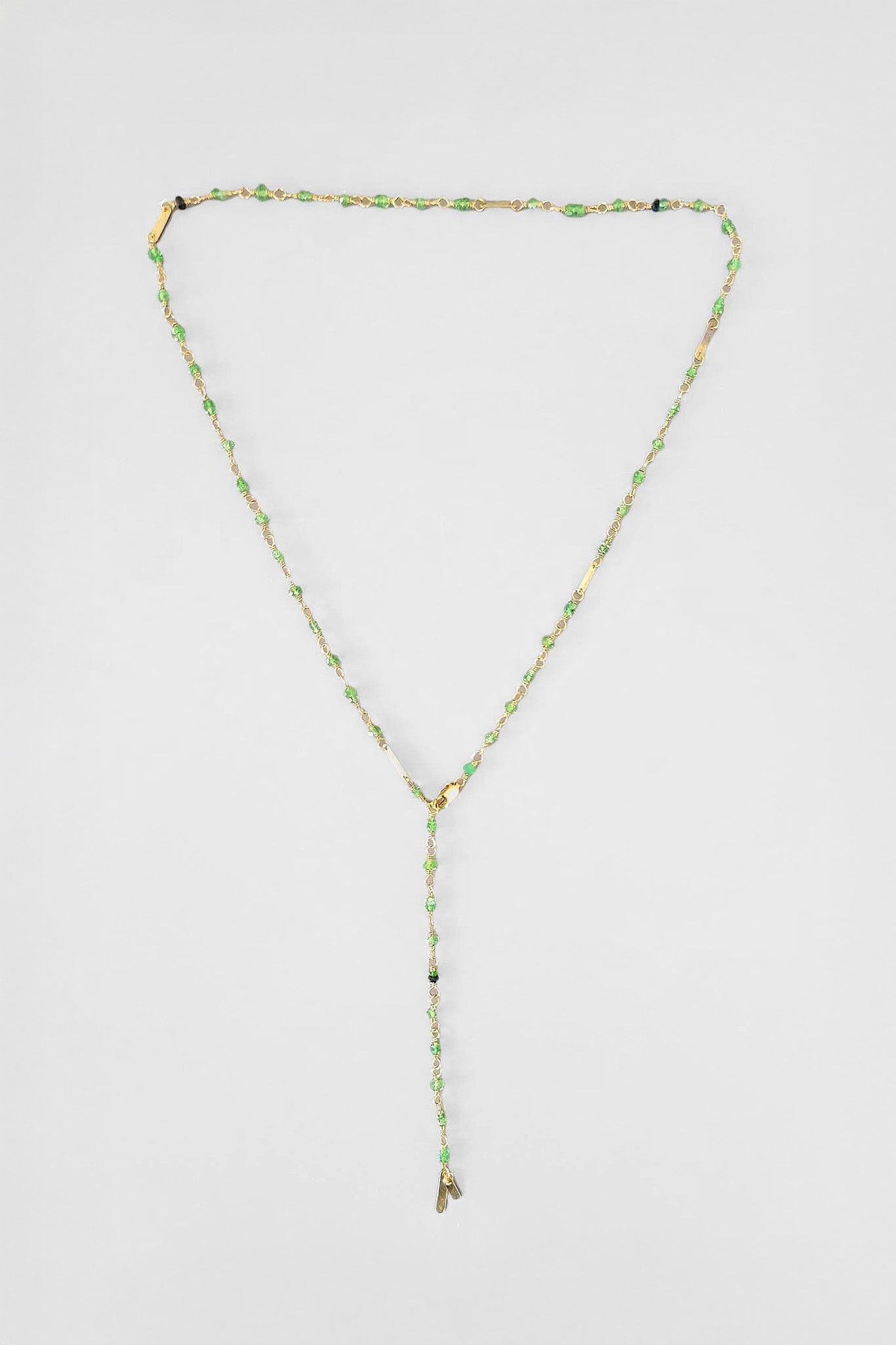 Beautiful green baguette necklace with 14k yellow gold baguette charms.