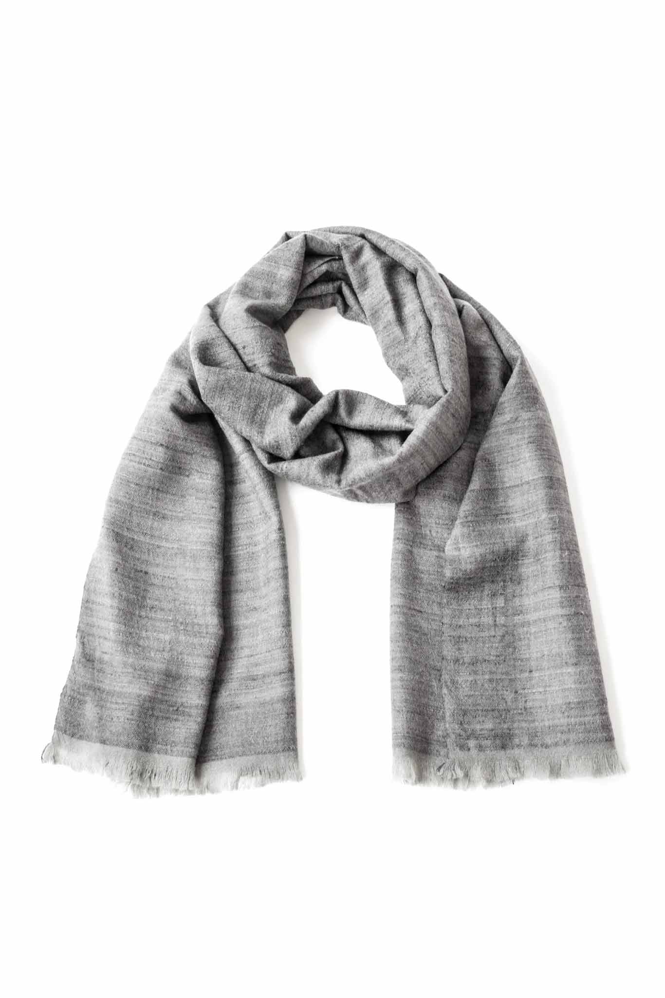A silver handwoven scarf made of silk and cashmere, displayed on a white background