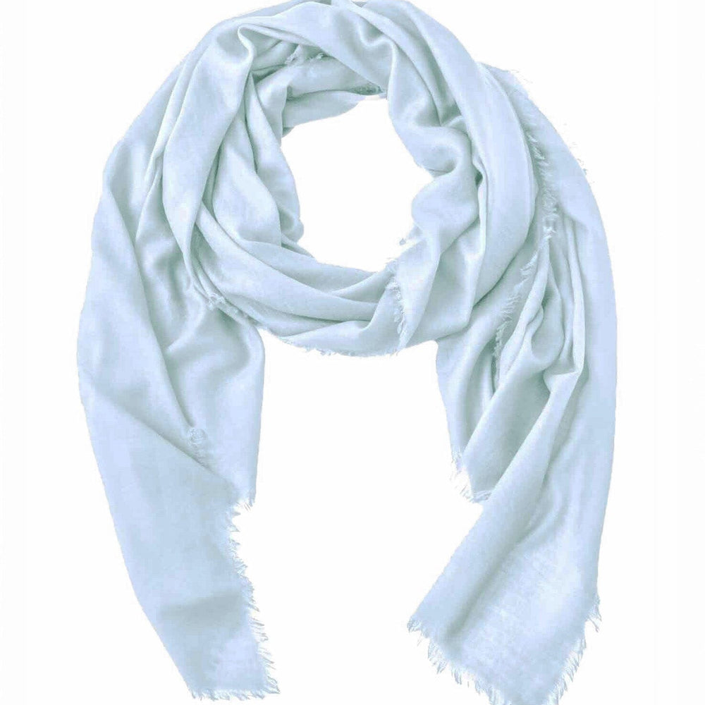 Light blue cashmere and merino wool scarf on a white background