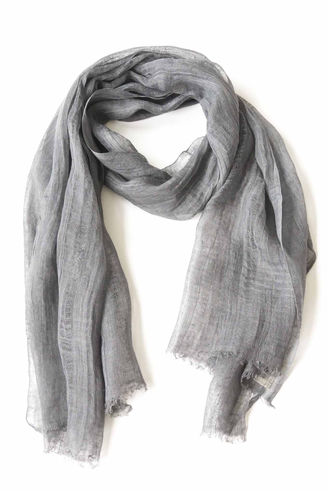 A silver handwoven scarf made of linen, displayed on a white background.