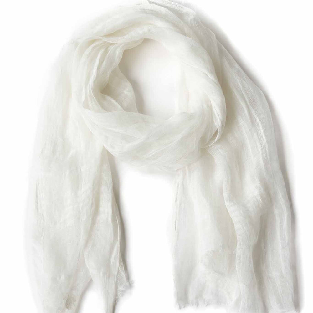 A handwoven, airy white scarf made of linen, displayed on a plain background.