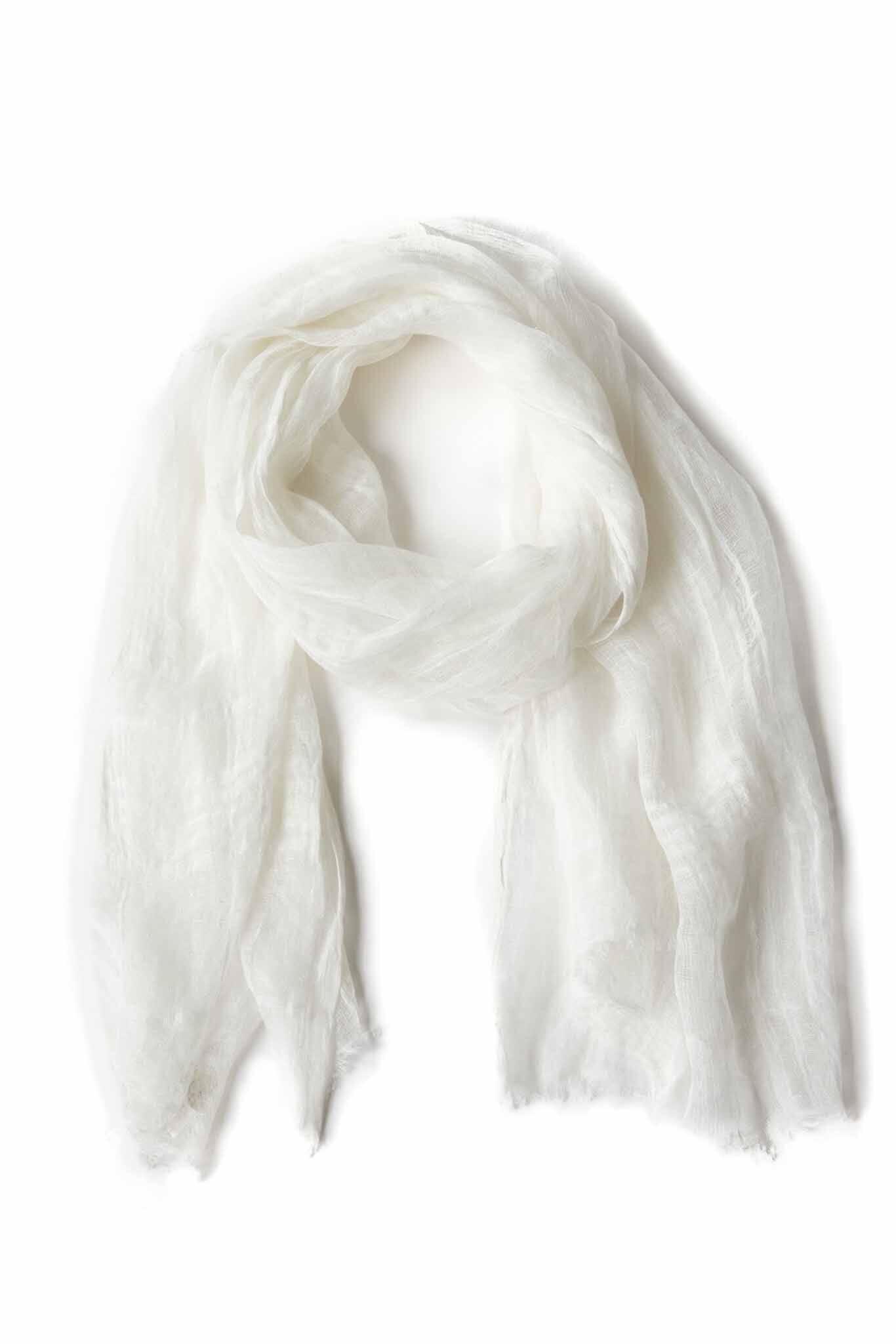 A handwoven, airy white scarf made of linen, displayed on a plain background.