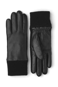 A pair of black gloves with elastic wrist cuffs and a knitted wool lining, made of leather and wool.