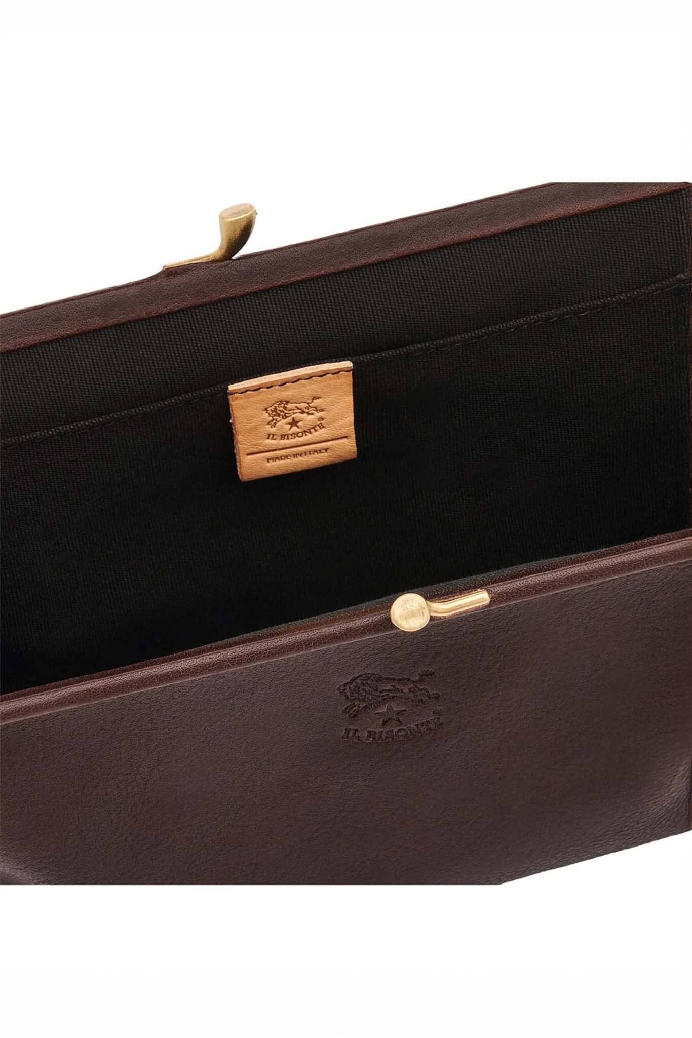 Brown leather clutch bag with gold accents on a white background