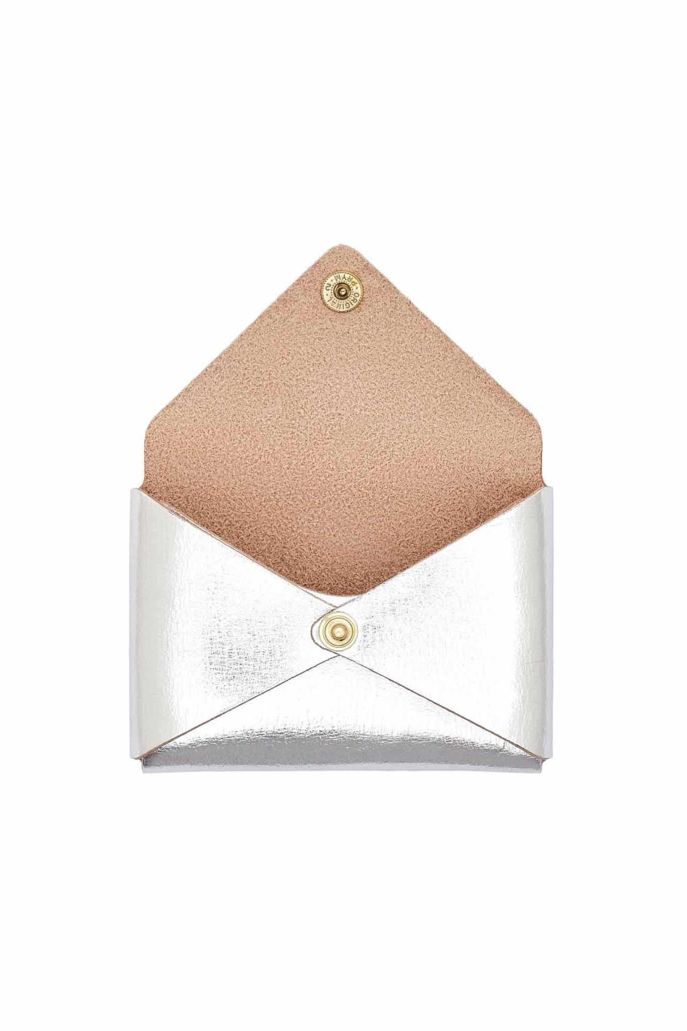 Small leather silver card case with suede interior with brass snap closure