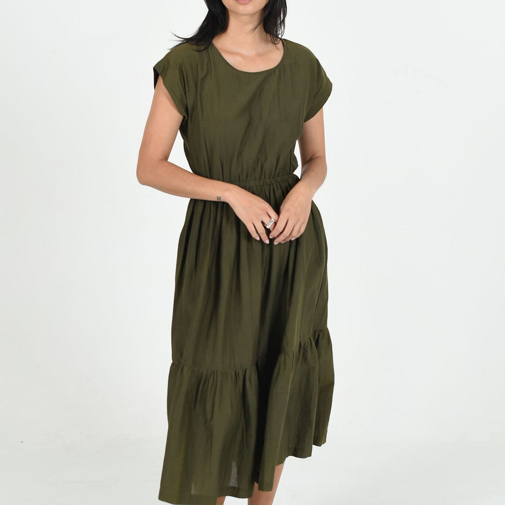 The M.PATMOS Olive Penelope Dress in large, features a relaxed fit, midi-length silhouette, button-down front, and belt at the waist for a flattering shape