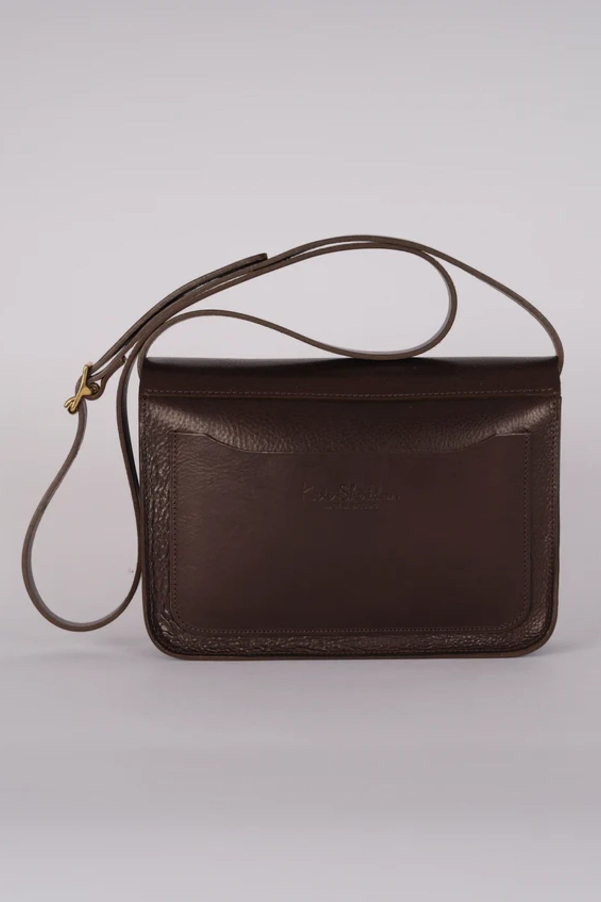 Back view of the brown leather Date Midi Tab Bag by Kate Sheridan, featuring an external slip pocket.
