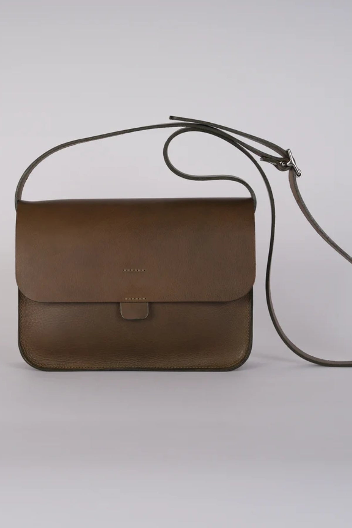 Front view of the green leather Kate Sheridan Olive Midi Tab Bag featuring a classic flap closure.