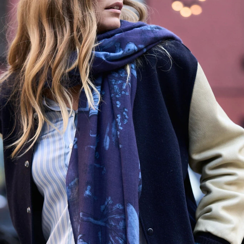 A model wears the Lalela blue toile silk, wool and cashmere scarf