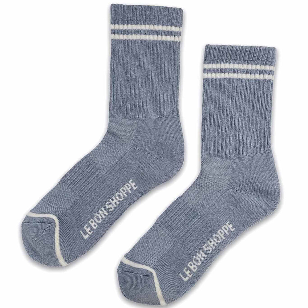 A flat shot of two ribbed grey blue crew socks