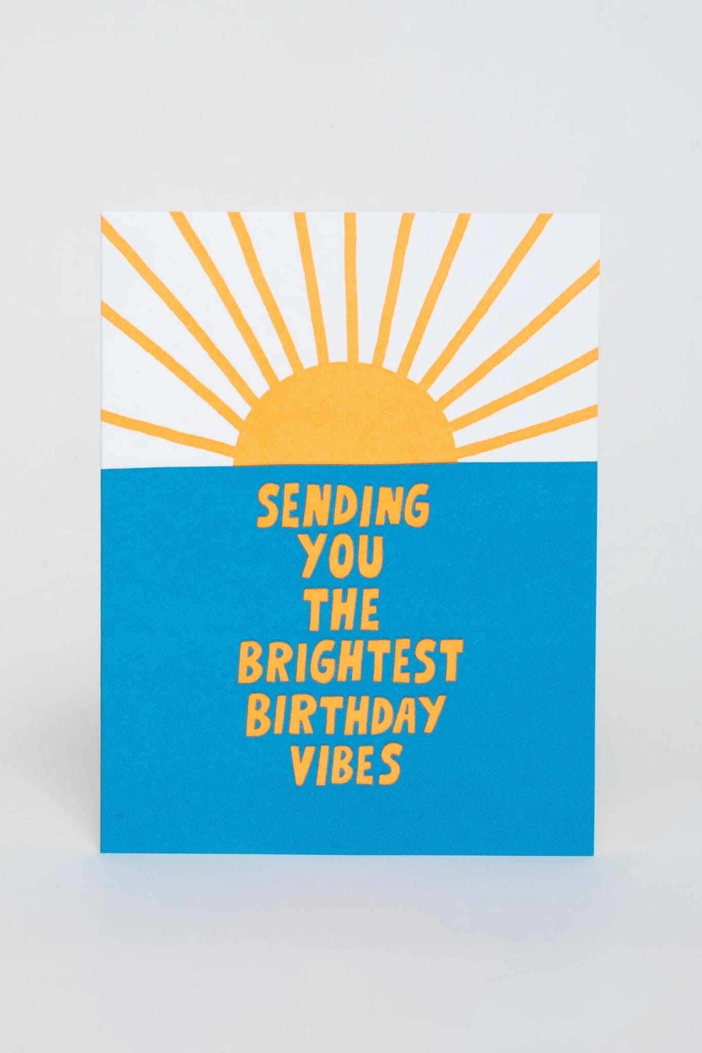Letterpress printed birthday card with a yellow sun reading Sending You The Brightest Birthday Vibes.
