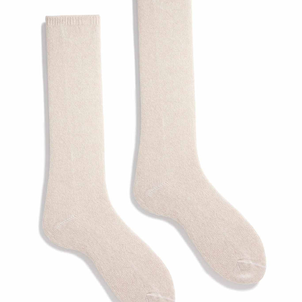 A pair of cream crew socks made of wool and cashmere, displayed against a white background.