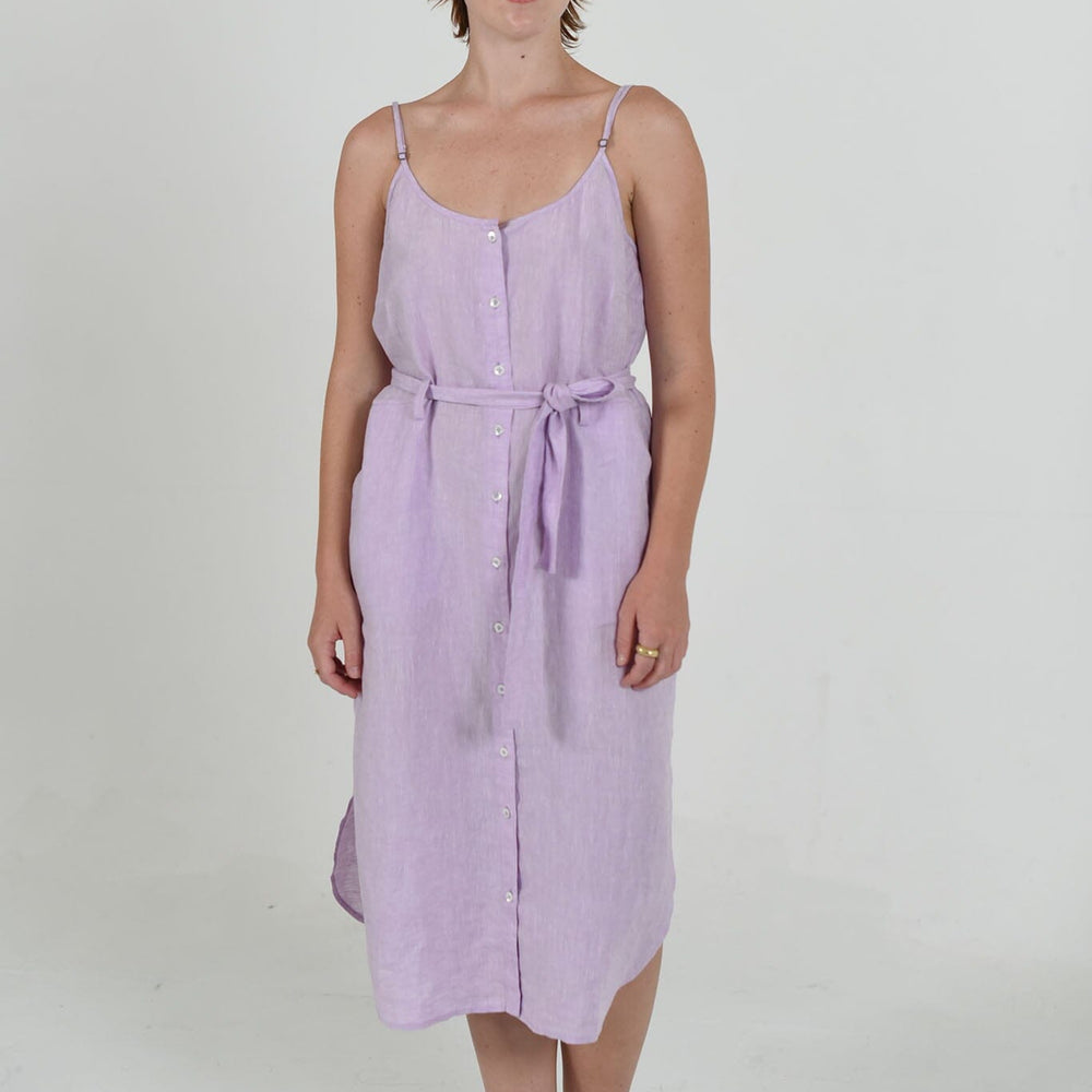 Tatum strappy dress by M.Patmos in lavender, size large, made from 100% linen, featuring a relaxed fit, functional pockets, fabric belt, and beautiful, natural fabric.