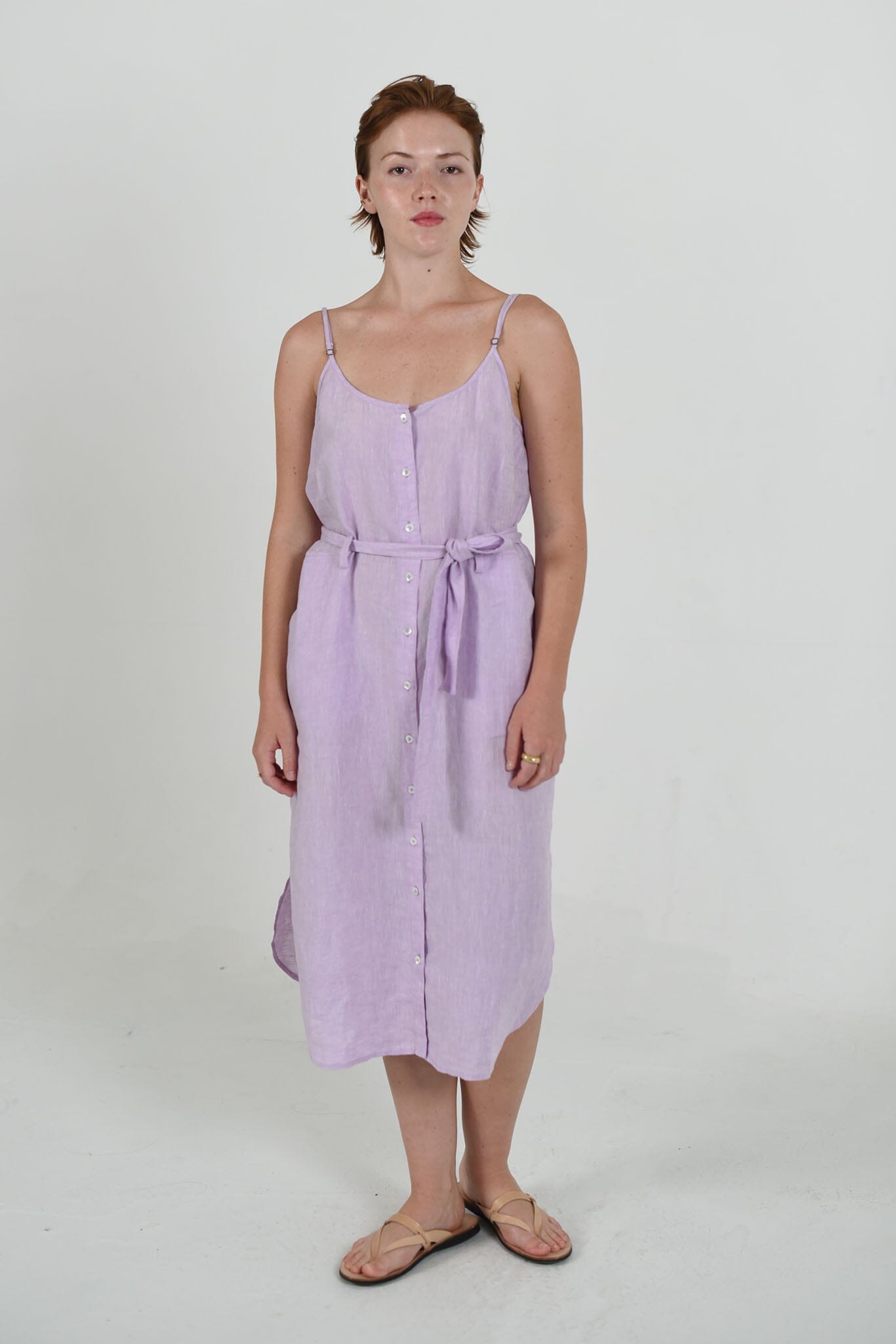 Tatum strappy dress by M.Patmos in lavender, size large, made from 100% linen, featuring a relaxed fit, functional pockets, fabric belt, and beautiful, natural fabric.