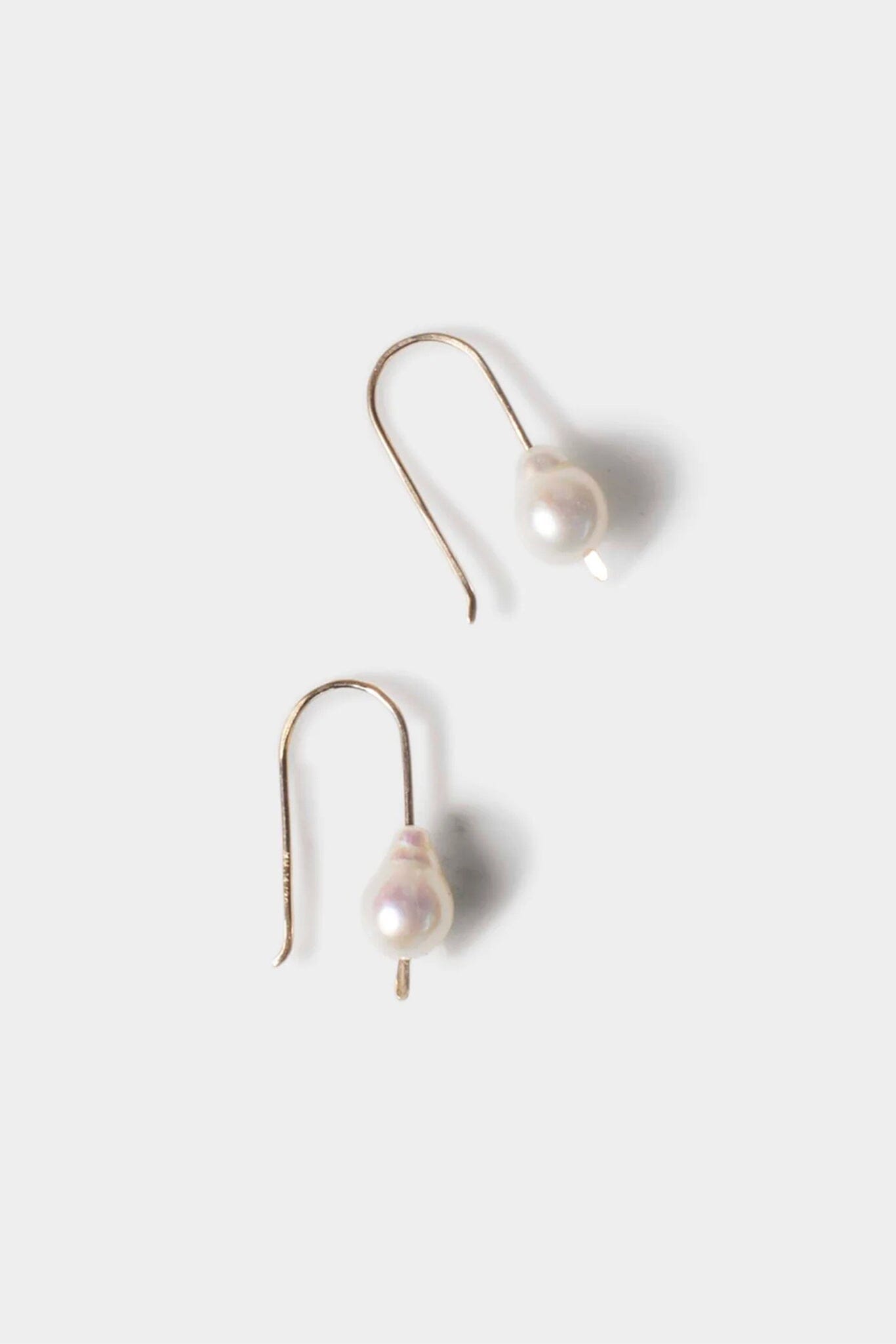 Pair of pearl earrings on a light background