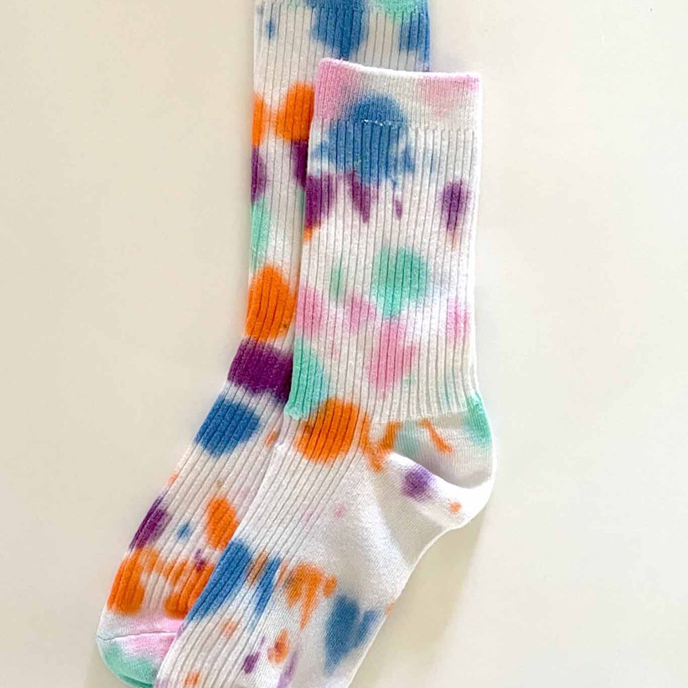 A pair of tie-dye cotton socks with multiple colors including white, pink, blue, and orange.