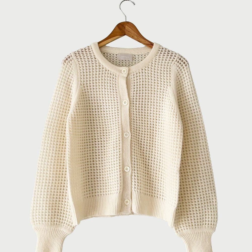 The medium Devin Mesh Cardigan in Ivory by M.Patmos is a  lightweight women's cardigan with an elegant mesh design, perfect for year-round layering.