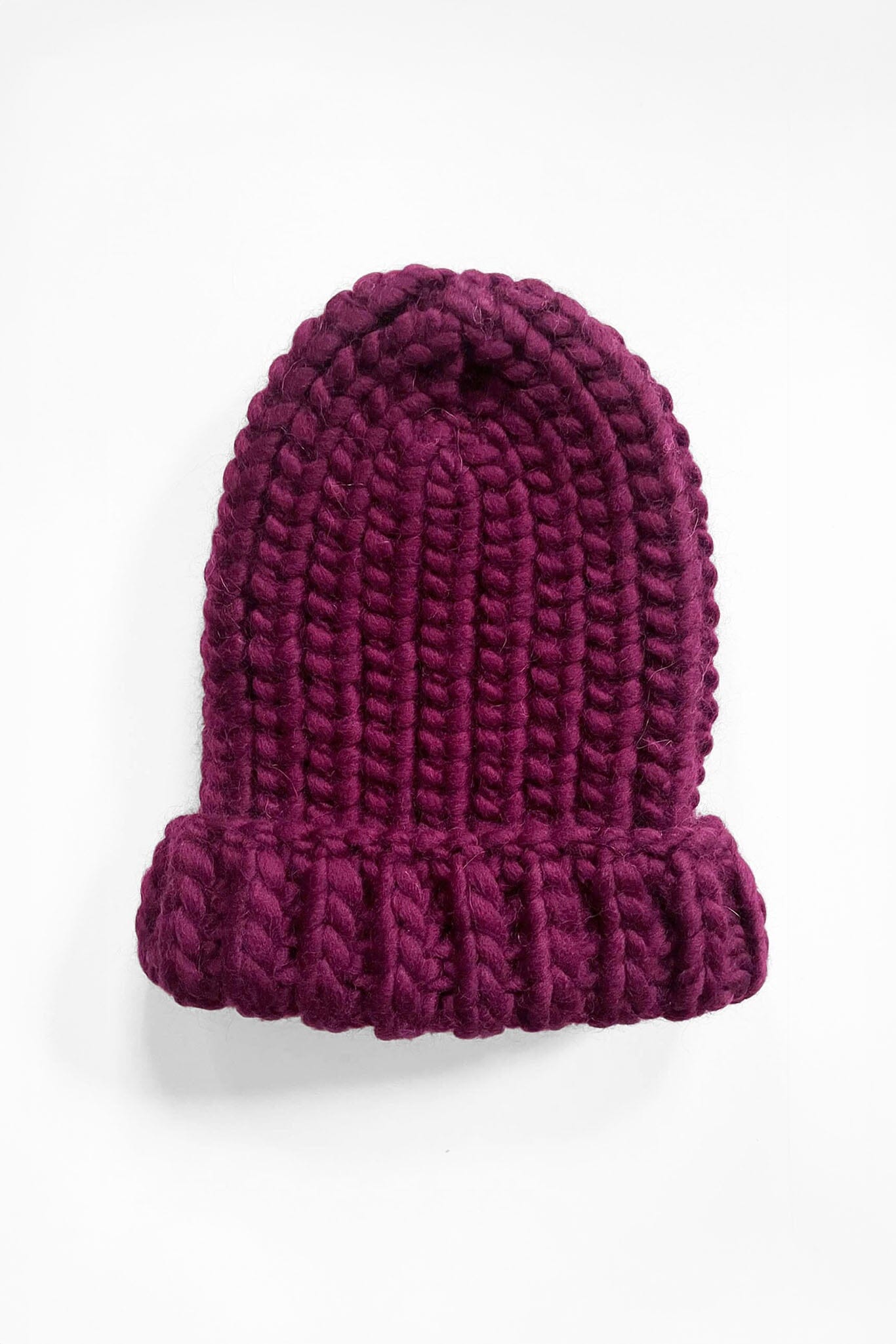 Hand knit wool hat in mulberry. Handmade by artisans in Peru. Designed by M.Patmos.