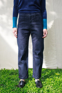 Woman wearing the M.PATMOS Belfry Pant in Deep Denim, a mid-rise, relaxed fit straight leg pant with surplus pockets.