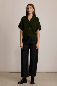 Woman wearing the M.PATMOS Belfry Pant in Black Denim, a mid-rise, relaxed fit straight leg pant with surplus pockets.