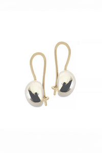 A pair of sterling silver drop earrings with 14k yellow gold ear wires, handmade in NYC.