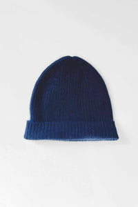 Knit cashmere navy beanie on a white background