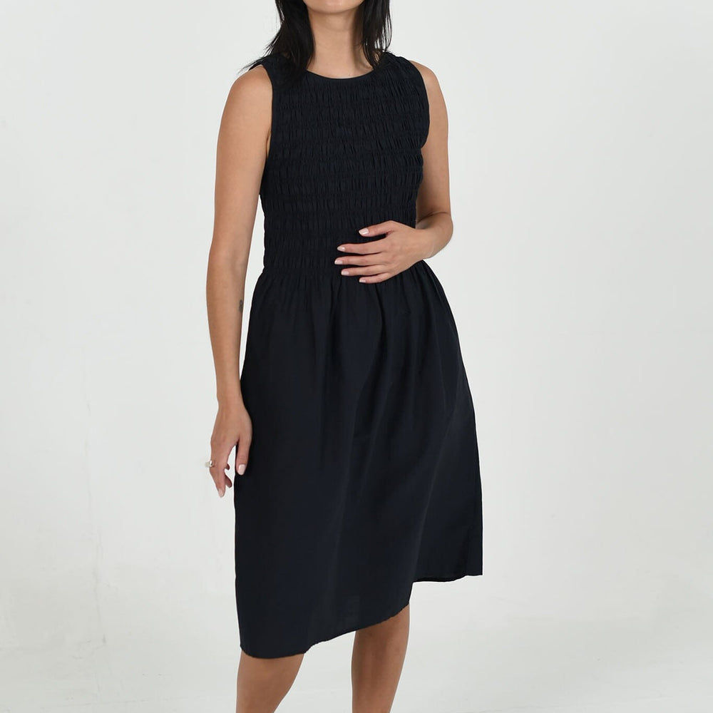 The M.Patmos black Bowie dress in size large features a relaxed, minimalist silhouette crafted with sustainable cotton-silk blend fabric