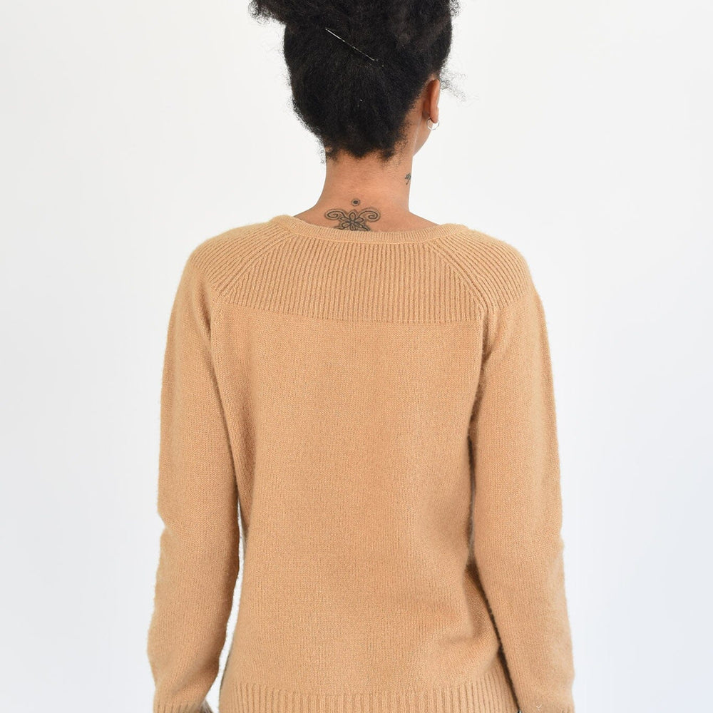The back view of a long sleeve brown cashmere sweater