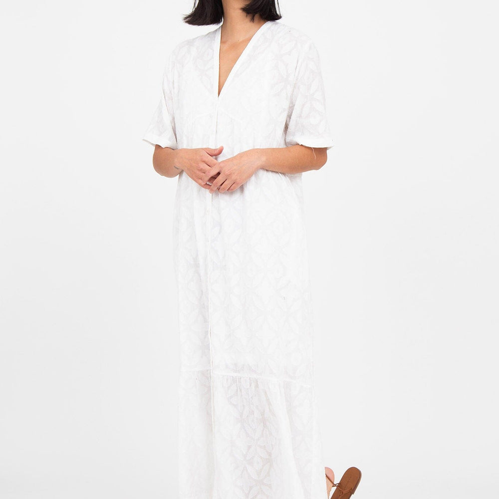 
                  
                    A woman wears the M.Patmos jacquard cotton long Linden dress in white. Designed in Brooklyn, New York.
                  
                