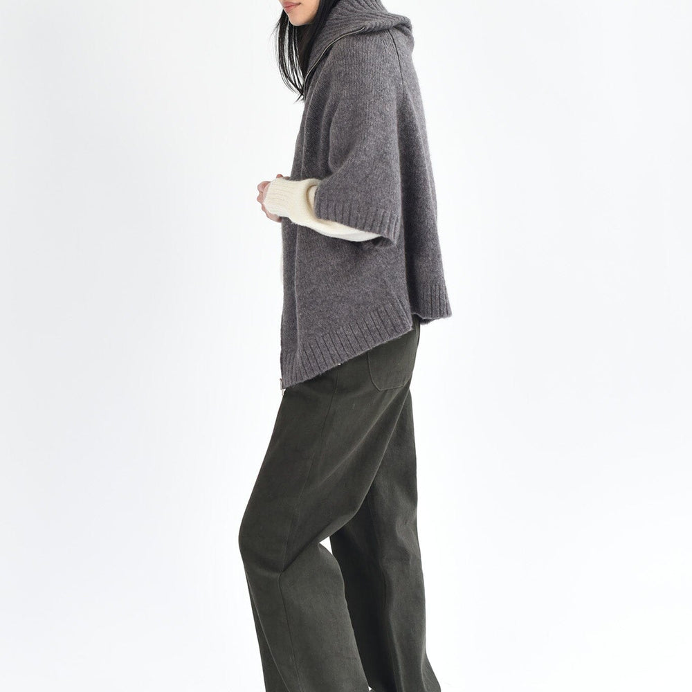 A woman wears the M.Patmos cotton Riverside pants in forest green. Designed in Brooklyn, New York.