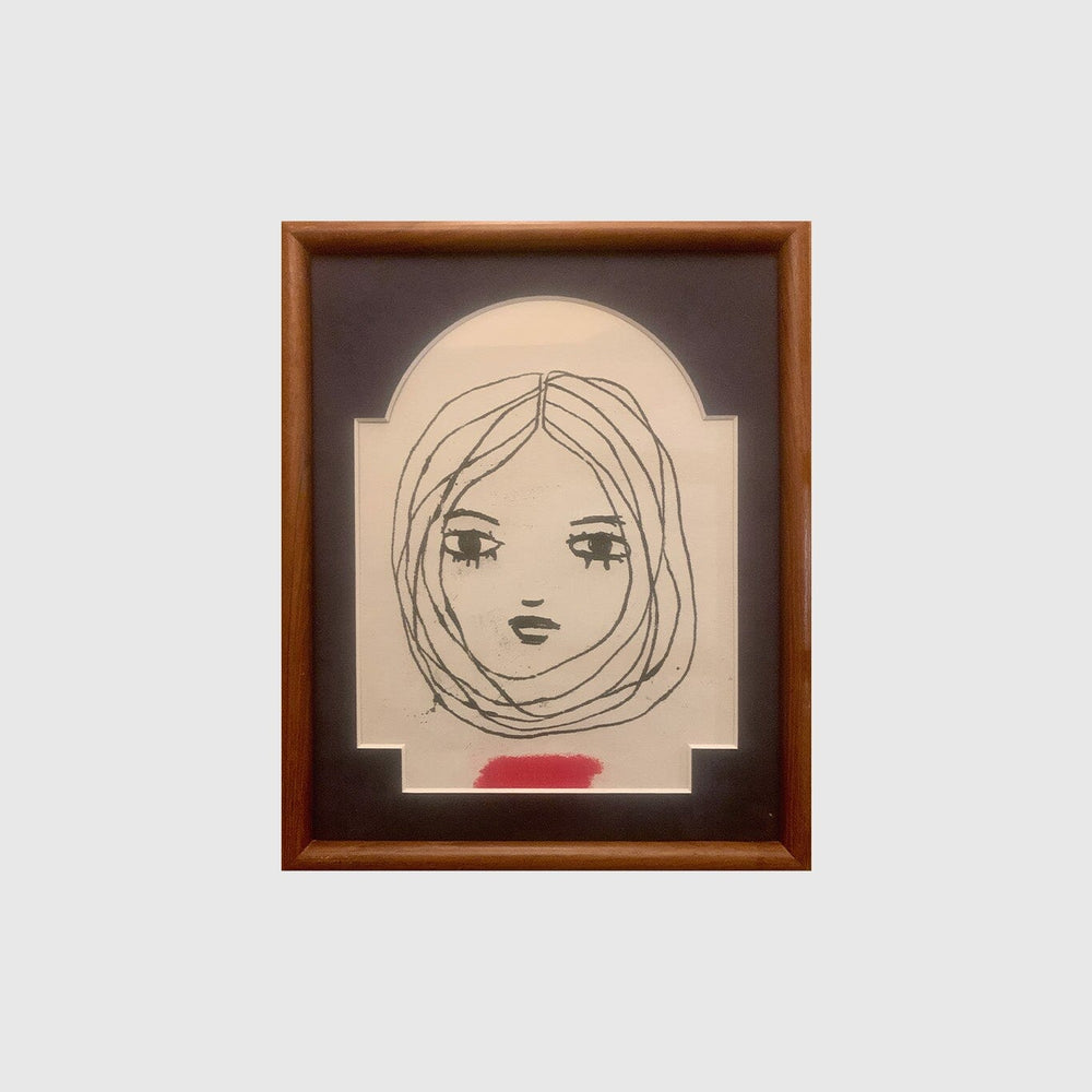 Small illustration of a woman's face in an rectangular frame.