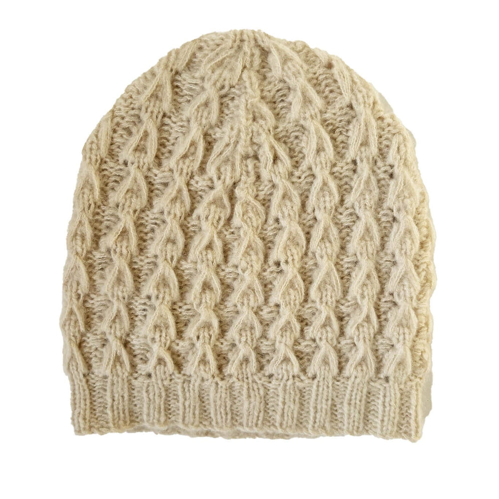 Beige knitted beanie on a white background