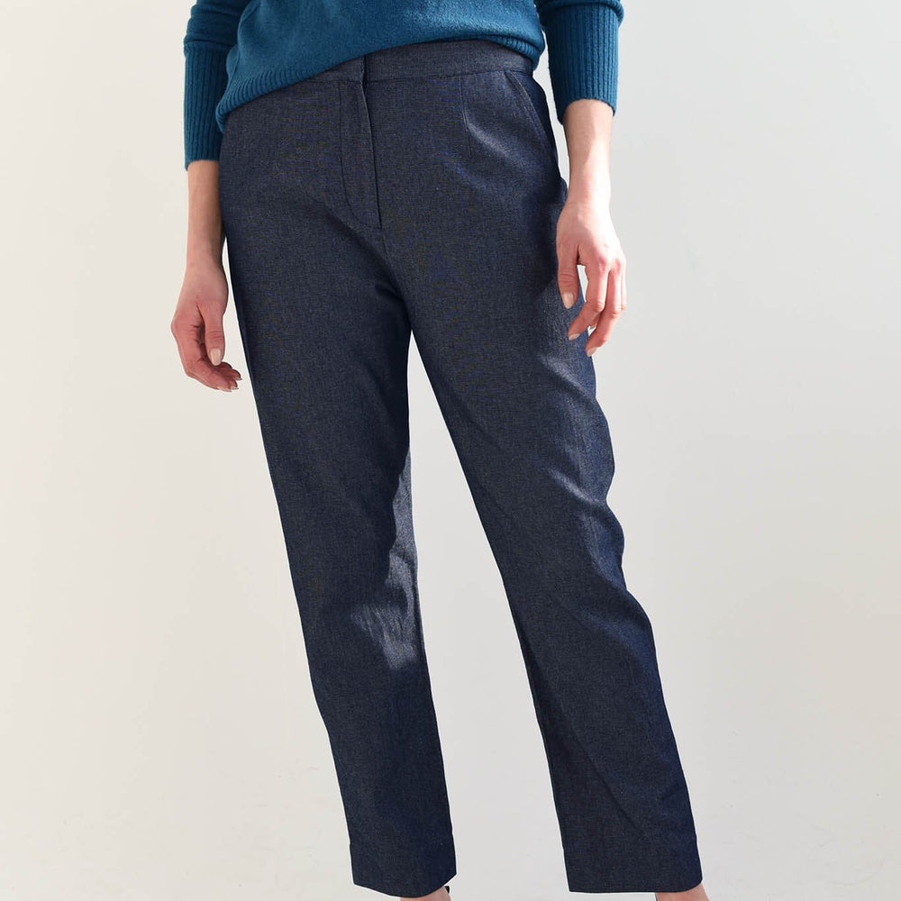 A woman wears the M.Patmos cotton Lou pants paired with black Alohas flats. Designed in Brooklyn, New York.