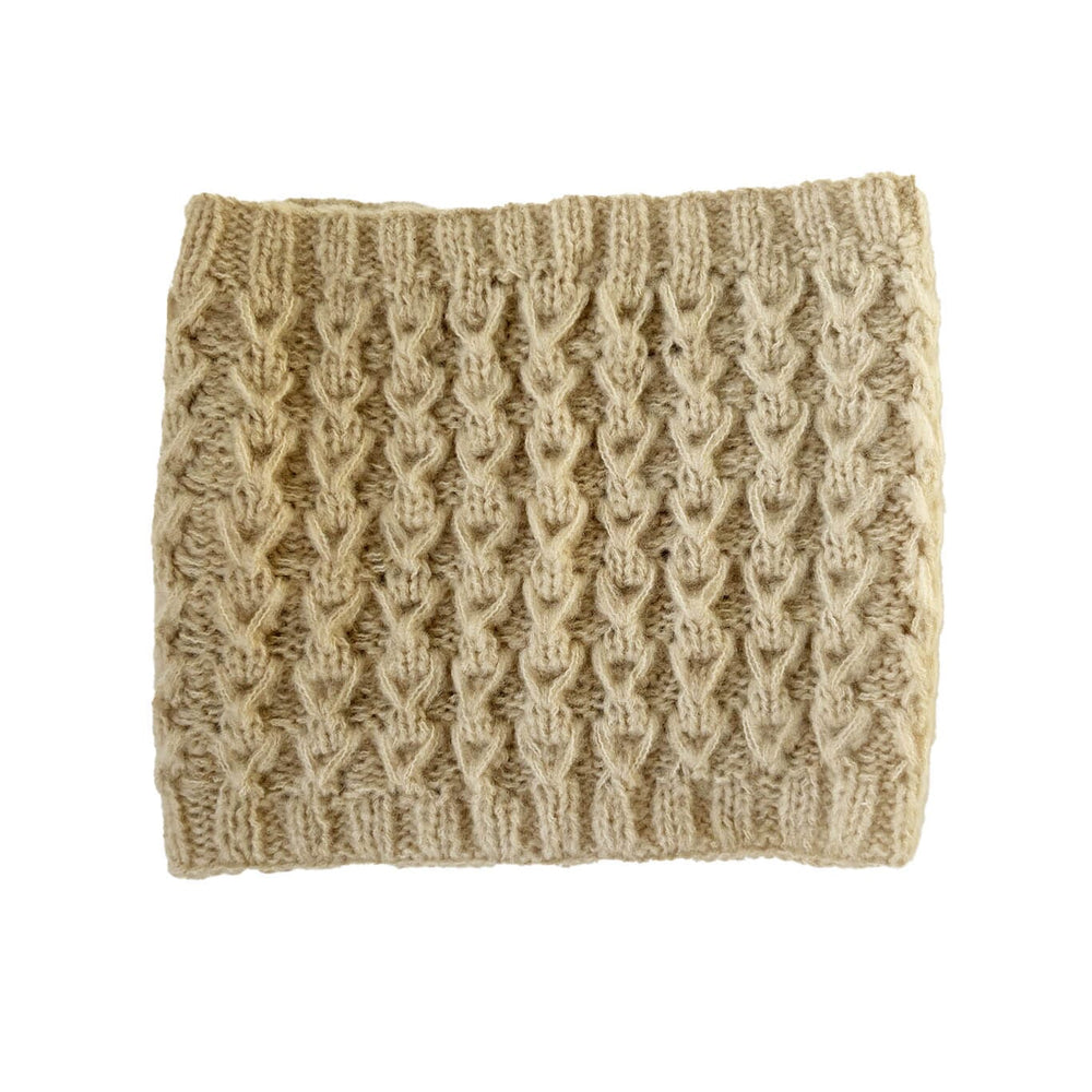 Knitted beige headband on a white background
