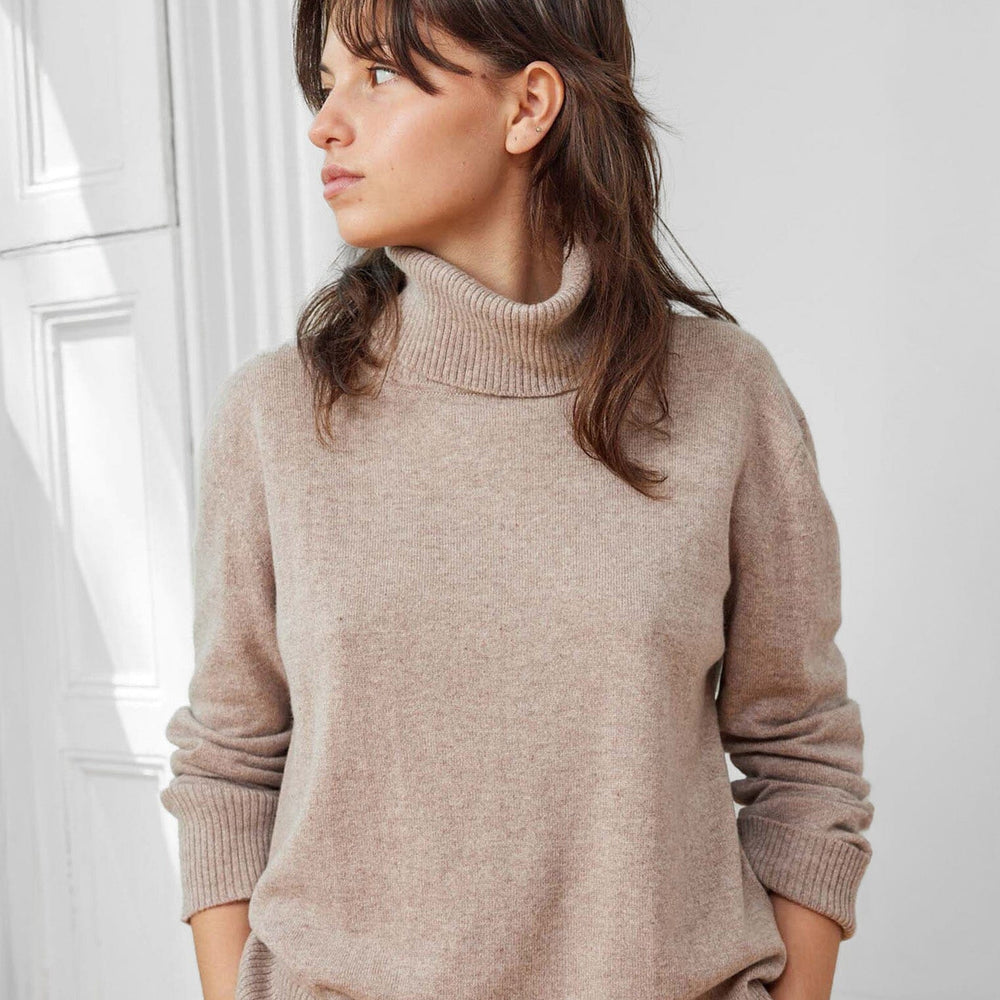 A timeless 100% Mongolian cashmere turtleneck sweater. Sophisticated for everyday winter wear. 