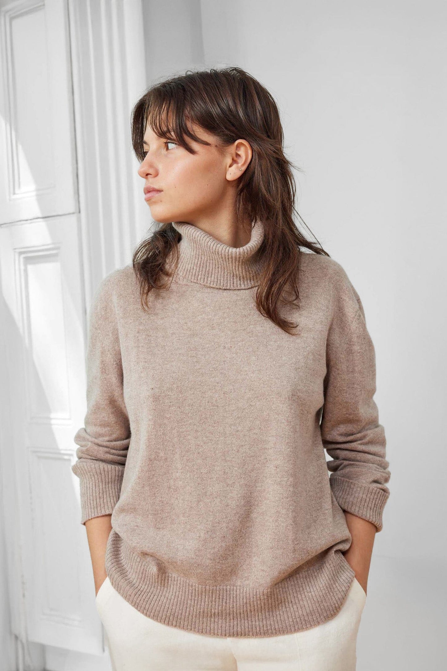 A timeless 100% Mongolian cashmere turtleneck sweater. Sophisticated for everyday winter wear. 